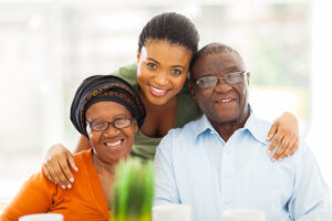 A woman uses flexible elder care solutions when caring for her aging parents.