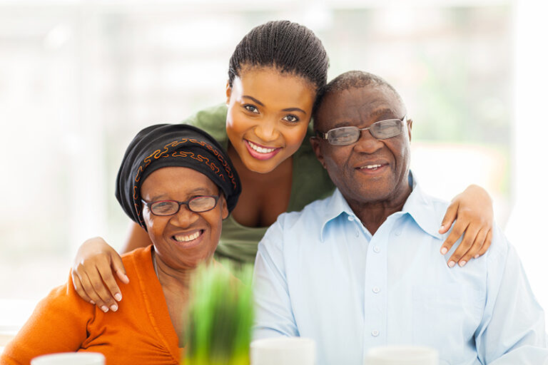 A woman uses flexible elder care solutions when caring for her aging parents.
