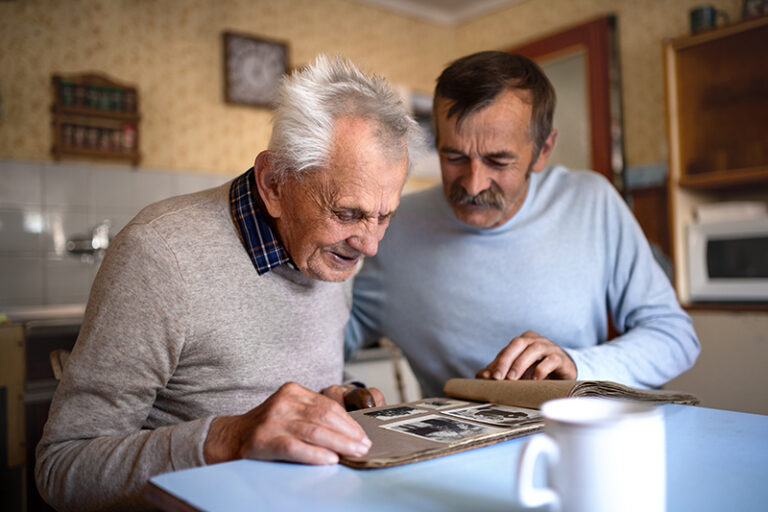 A man uses sports memorabilia with his aging father as a way of engaging seniors with dementia.