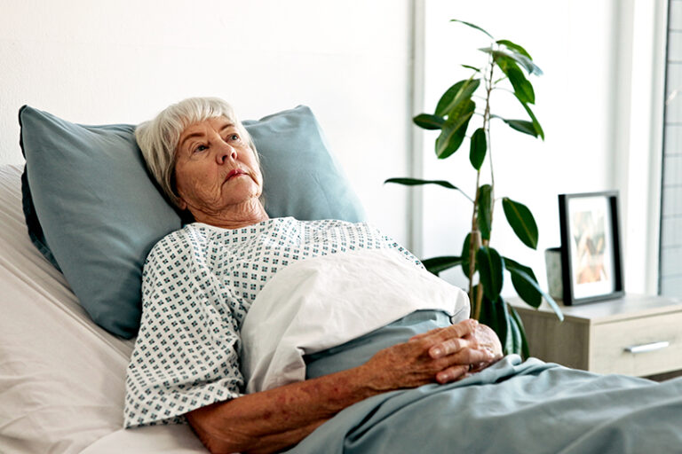 A senior woman considers long-term rehab home care to aid in her recovery.