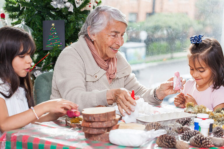 A family creates story ornaments as a dementia holiday craft to bring memories to life.