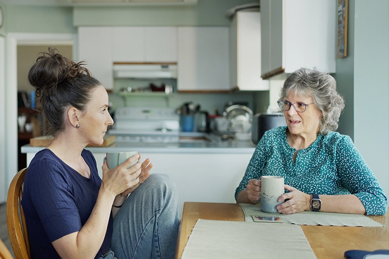 A woman chats with her elderly mother who she suspects is showing dementia personality changes.