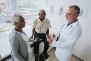 A family is advocating for an aging parent during a conversation with a healthcare provider.
