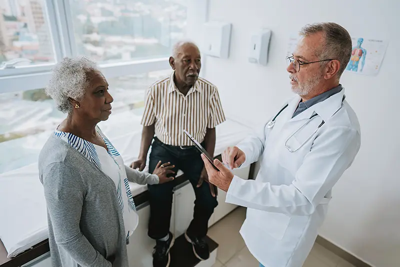 A family is advocating for an aging parent during a conversation with a healthcare provider.